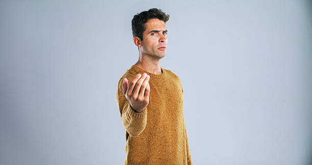 istock Portrait, hand gesture and man with threat, blame and selection on white studio background. Angry, person and model with warning, fight and mockup space with danger and disagreement accountability 2224474859
