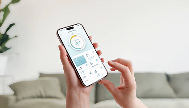 istock Smart home interface on smartphone showing temperature control and connected devices in cozy living space 2224475277