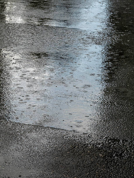 istock Heavy rain on the a street, close up 2224481368