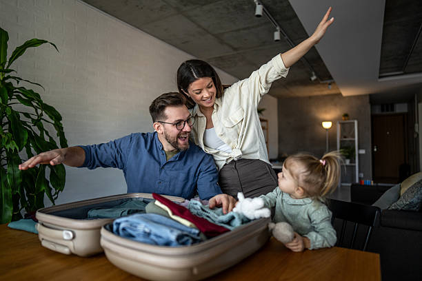 istock Family packing suitcase for vacation at home 2224482301