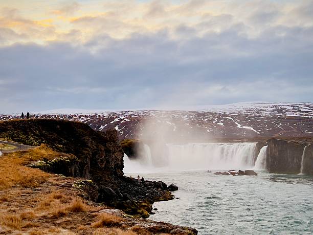 A dramatic wide and awe view of famous waterfall in Iceland - Godafoss aka Waterfall of the Gods in North-Eastern Iceland