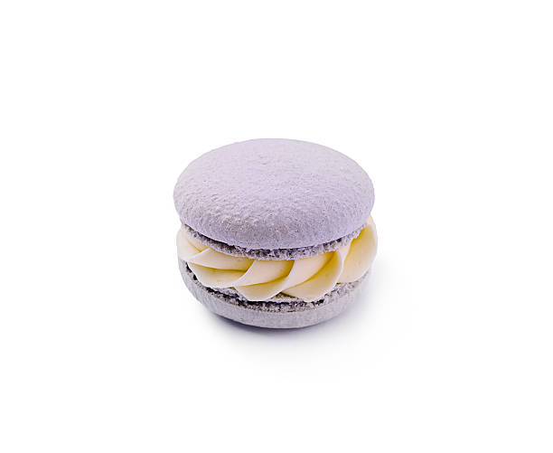 istock Lavender macaron with creamy filling presented on a white background 2224482646