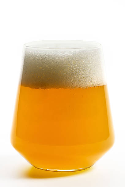 istock Cold light beer with foam in modern glass on white. 2224482972