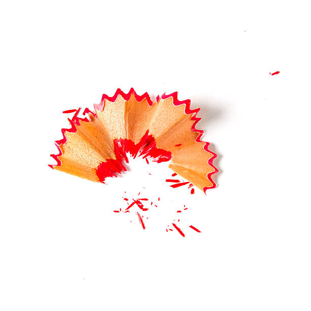 istock Red pencil tip shavings from sharpener on white background . 2224485469