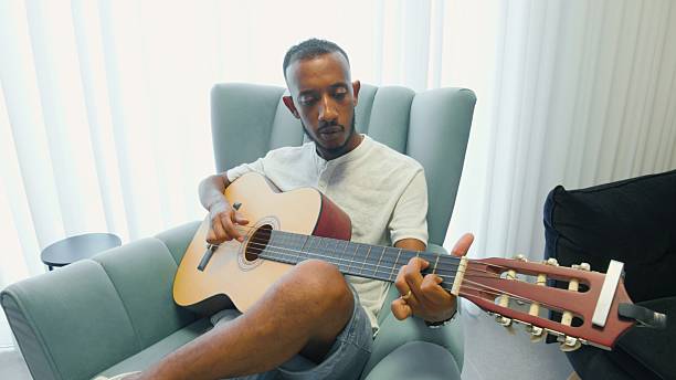 Close-up of guitarist playing his electric guitar
