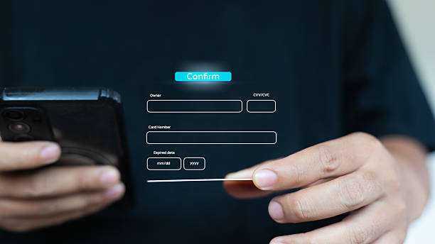 istock Hand holding smartphone and credit card with online payment form, digital transaction, secure mobile payment, and credit card information confirmation concept. 2224486034