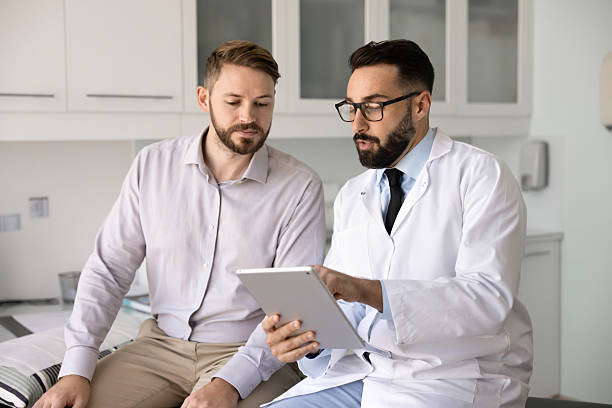 istock Latin physician doctor explaining medical checkup report 2224486905