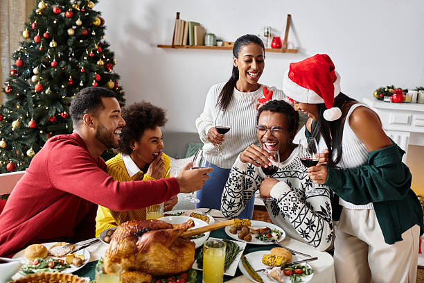 istock Friends gather around a festive table celebrating together with laughter and joy during dinner 2224486927