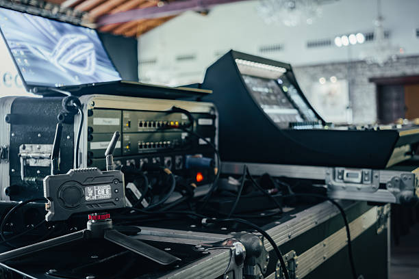 istock Equipment ready for audio and video transmission at a live event. Wireless video transmitter, connection rack, laptop, and audio mixer. 2224487306