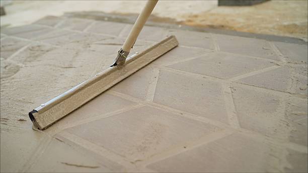 istock Mop clean pavement tiles. The master tile smears the mucilage solution on the tile. 2224487332