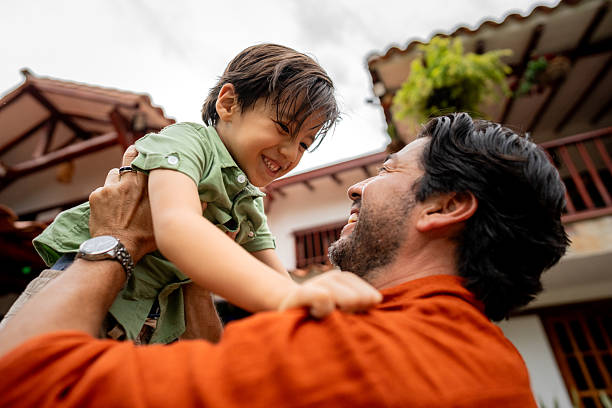 Father and son playing in the backyard