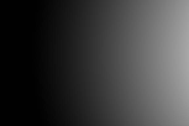istock Background and black surface with white color. Gradient black and white abstract background. light grey on the left to deep black on the right. It creates a subtle, modern, and minimalistic visual 2224492696