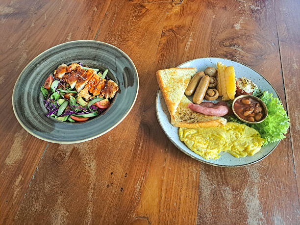 Chicken Salad Honey Ranch Dressing With Mix Salad, Tomato Cherry, Onion, Cucumber, Avocado, Grilled Chicken, Parsley. Restaurant Breakfast With Choised Egg, Beef Sausage, Potato Wedges, Baked Bean, Lettuce, Mushroom Champignon, Smoked Beef And Toast Bread