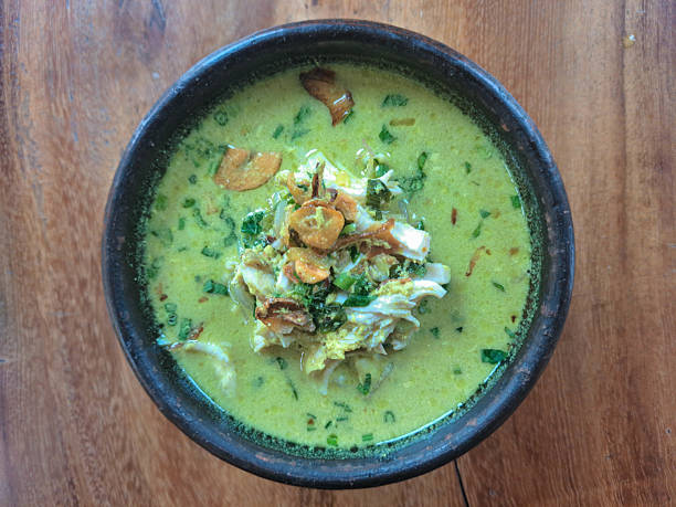Kare Kari Ayam Or Chicken Curry With Shredded Chicken Meat, Coconut Milk, Galangal, Chicken Broth, Fried Onion, Fried shallot, Cabbage, Celery. Indonesia Food Menu. Top View.