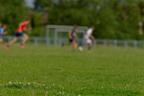 istock Exciting Soccer Game Action Unfolding on the Lush Grass Field Today 2224500568