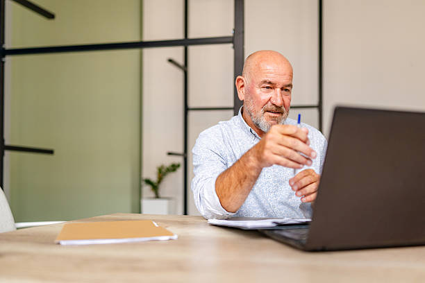 istock Mature worker attending online conference 2224502356