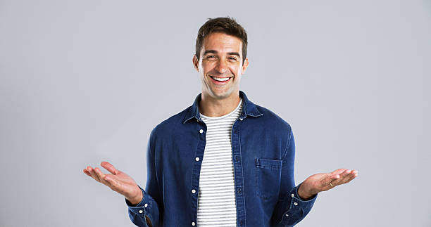 istock Studio, man and portrait with hands for choice, question and  expression with balance for options. Mockup space, male person and happy with gesture for scale, decision and smile in white background 2224508064