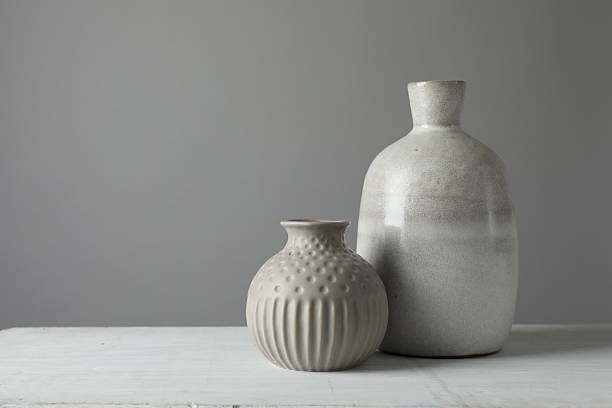 istock Stylish vases on white table against grey background, space for text 2224512563