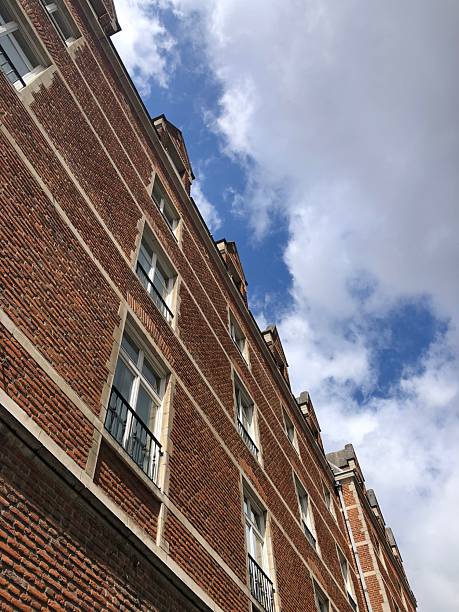istock Brick building with a clear blue sky with clouds 2224518214