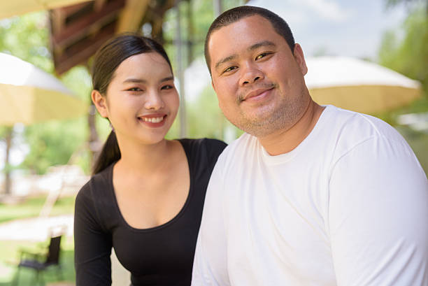 istock Happy couple smiling in cafe restaurant together 2224518350