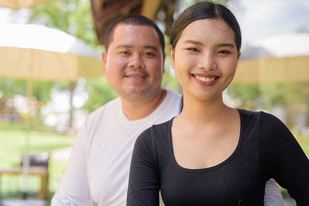 istock Happy couple smiling in cafe restaurant together 2224518377