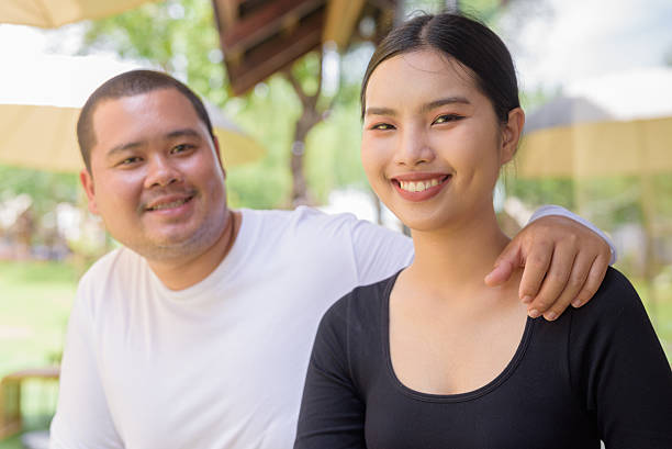 istock Happy couple smiling in cafe restaurant together 2224518410
