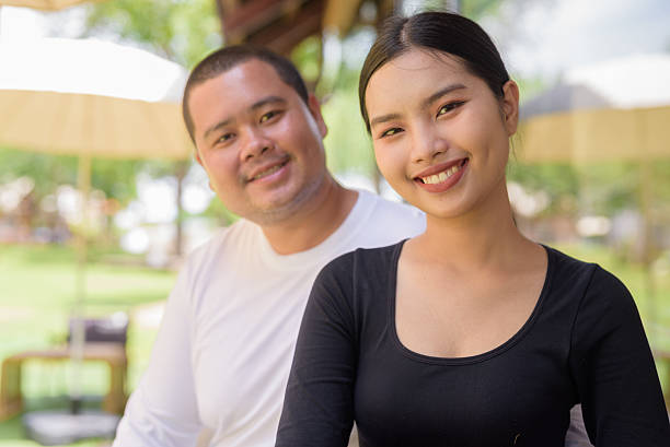 istock Happy couple smiling in cafe restaurant together 2224518437