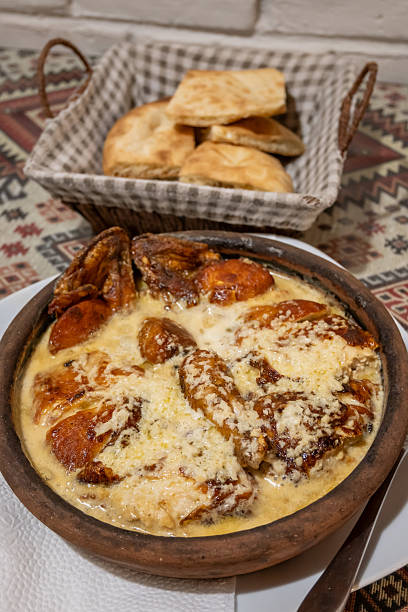 istock Georgian Chicken Shkmeruli Dish and Bread, a Traditional Culinary Experience 2224519346