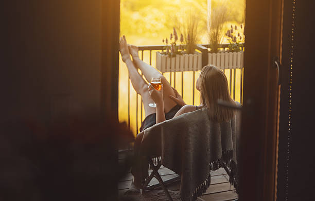 istock Woman enjoying her rose wine on balcony. 2224520389