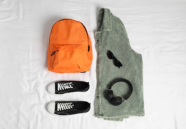 istock Stylish outfit with backpack on white fabric, flat lay 2224521268
