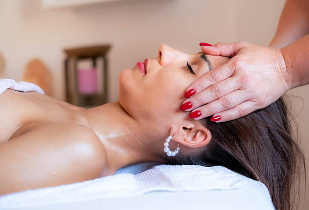 istock woman face massage 2224522105