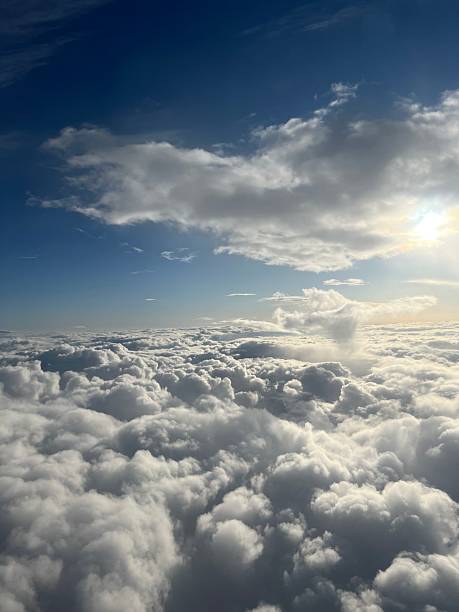 istock Cloudscape, the blue sunny sky above the clouds 2224523816