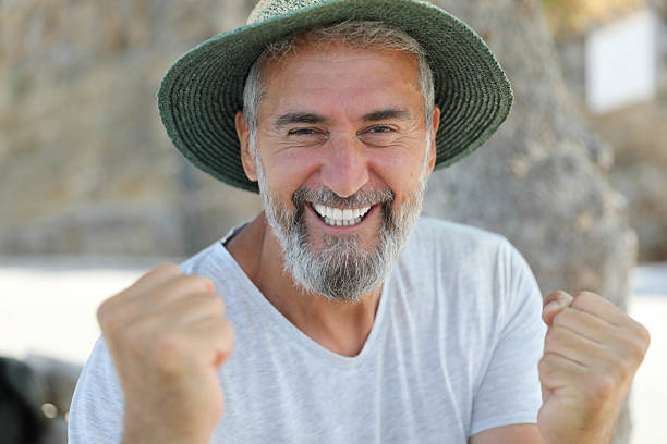 A happy senior American man laughing out loud