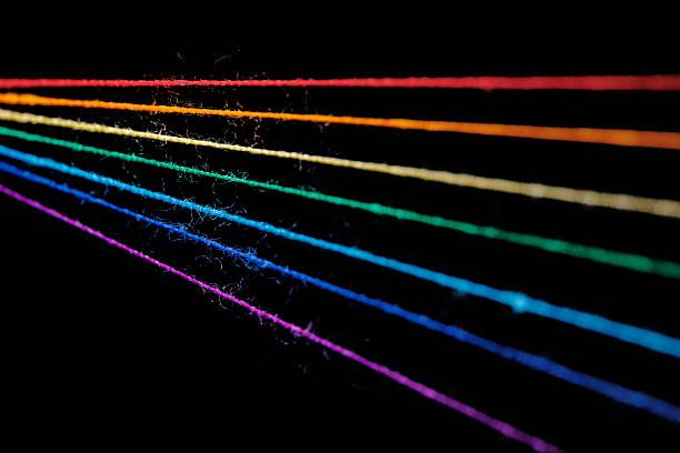istock multicolored sewing threads in the form of a rainbow on a black background 2224527674