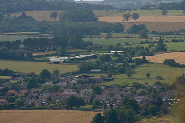 istock View over fields into the distance with a village in the valley 2224529029