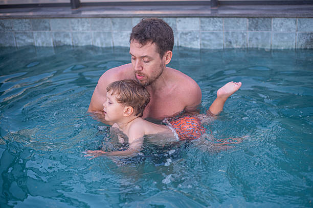 istock Dad giving his son a swimming lesson 2224530145