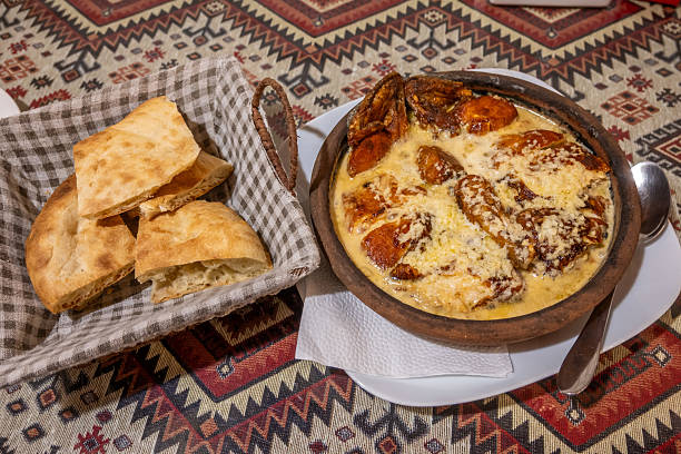 Georgian Chicken Shkmeruli Dish and Bread, a Traditional Culinary Experience
