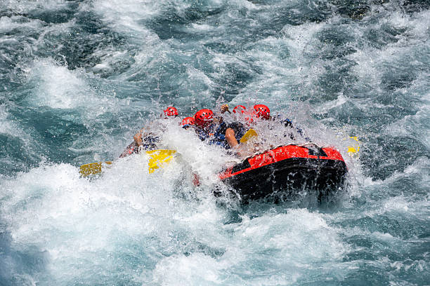 istock Group of People White Water Rafting on a Wild River 2224530405