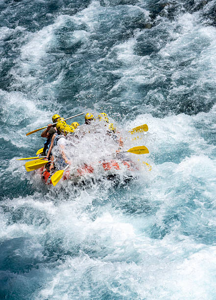 istock Group of People White Water Rafting on a Wild River 2224530542