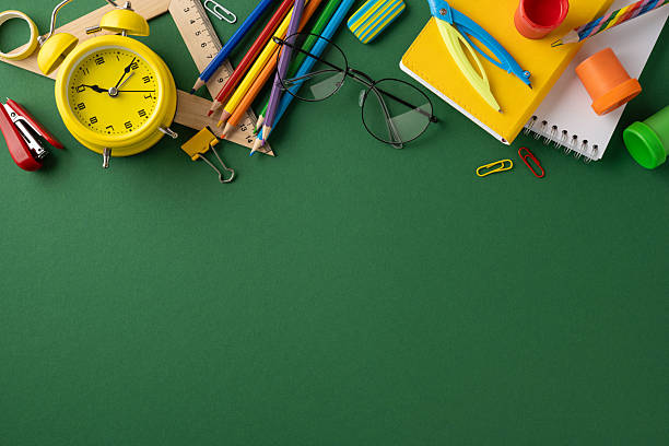 istock A creative layout of assorted school stationery on a green backdrop ideal for designs 2224532128
