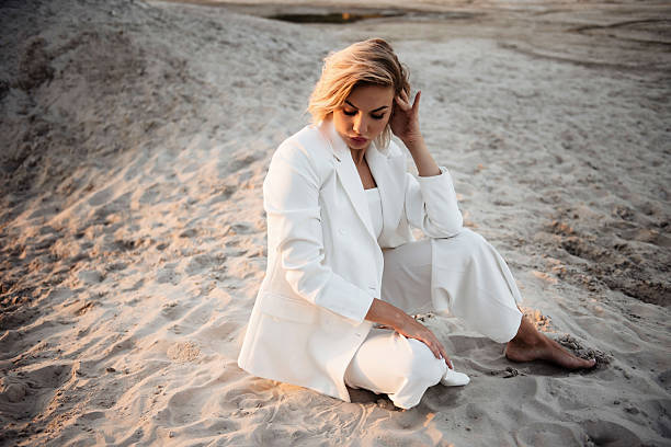 istock Woman in White Suit on Sandy Terrain 2224533841