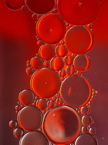 istock Oil bubbles. Oil bubbles on water. Abstract texture in red tones 2224534333