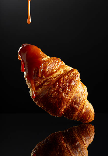 istock Fresh baked croissant with caramel sauce. 2224535485