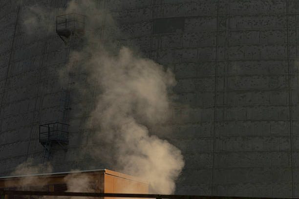At night, smoke is visibly pouring out from a building, creating an unsettling scene that attracts attention in the dark surroundings