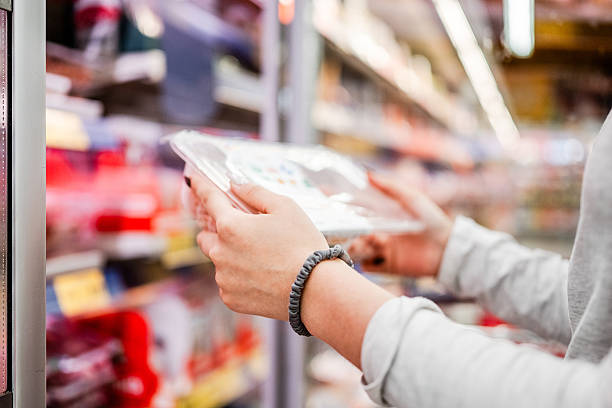 istock Girl Taking Pack From Fridge In Supermarket 2224541851
