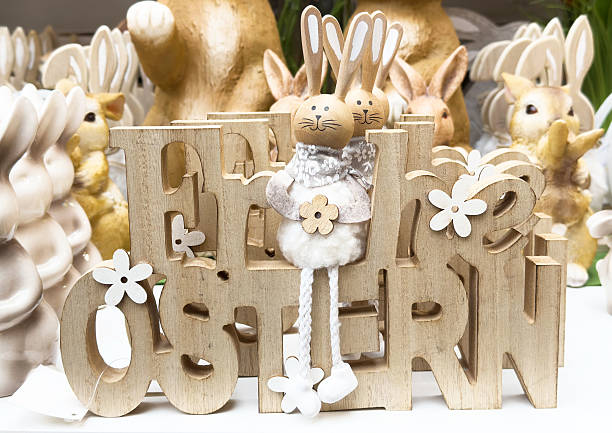 istock Wooden easter bunny decor with flowers and playful design 2224541861