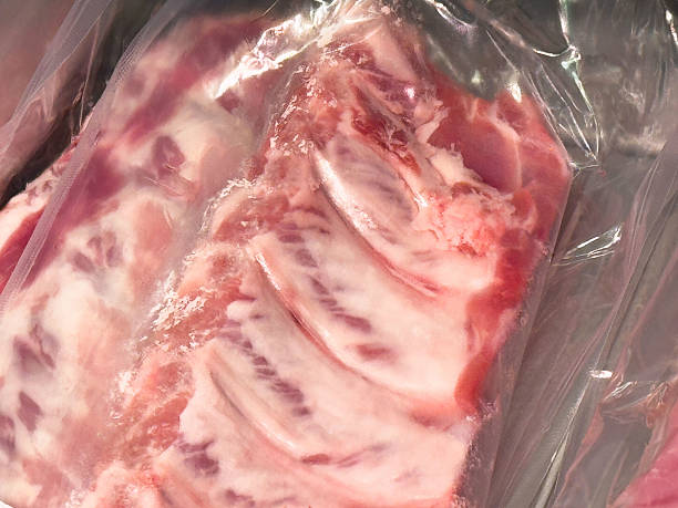istock Close-up of raw pork ribs in plastic packaging for freshness 2224543845