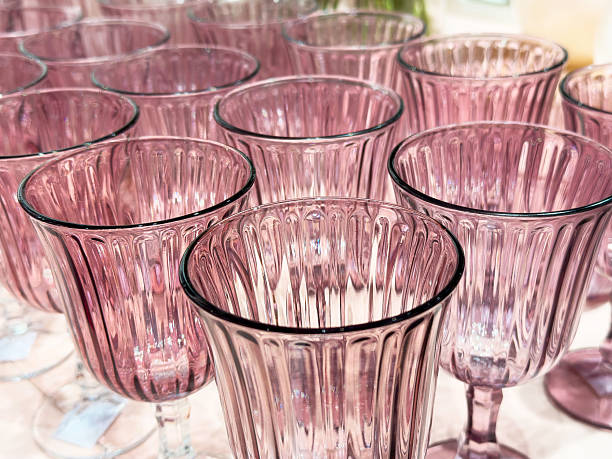 istock Elegant pink glass goblets with intricate ribbed patterns 2224544302