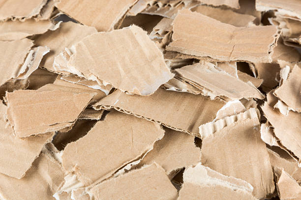 a lots of small pieces of torn cardboard background