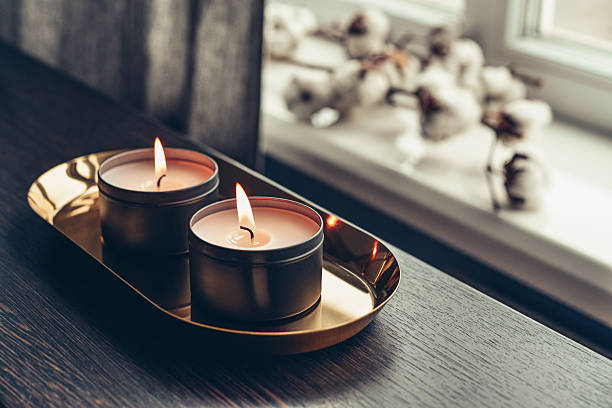 istock Burning candles on golden tray 2224546458